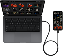 El iPhone 15 Pro Max conectado a una MacBook Pro de 14 pulgadas con USB-C